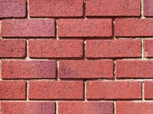 Fretting mortar crumbling from the joints of a Perth brick wall